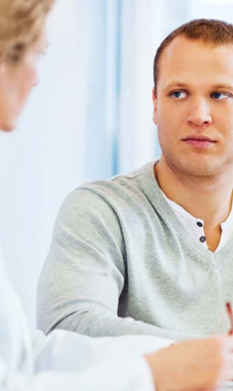 Man listening intently to a doctor