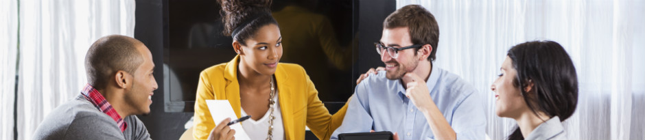 Two males and two females in a meeting