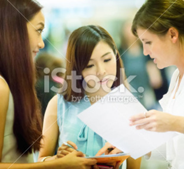 Event hostess offers help with registration