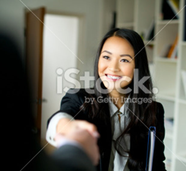 Women shaking hands at job interview